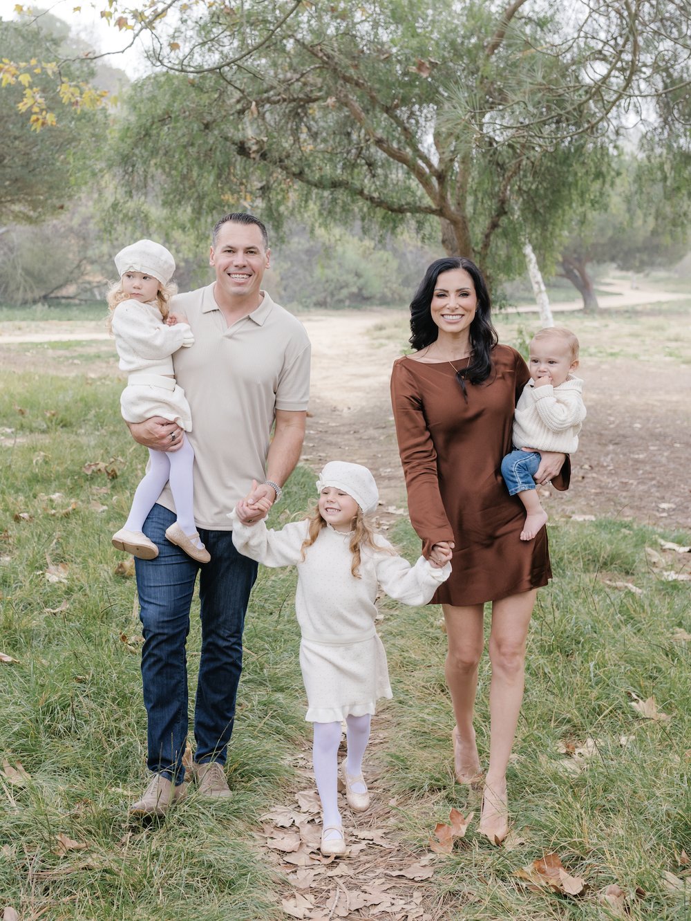 Tyler and Brittani Rogina with their three children